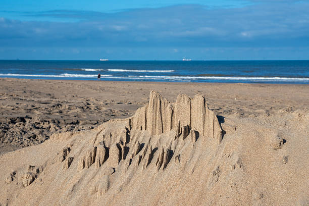 Sandcastle on a sandy beach with copy space on the sand.Click on the link below to see more of my travel images.