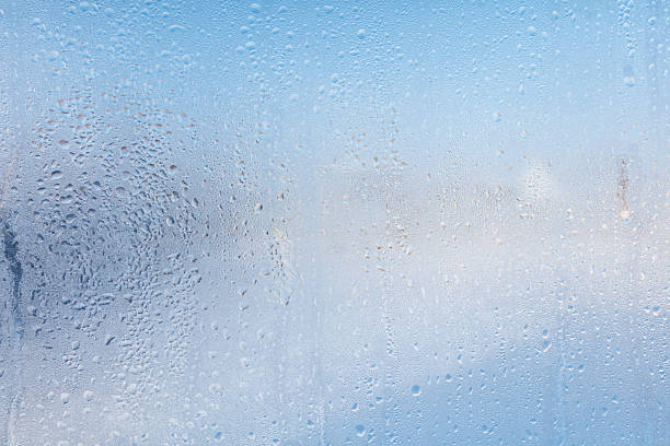 istock Frozen water drops on glass as an abstract background. 2240229894