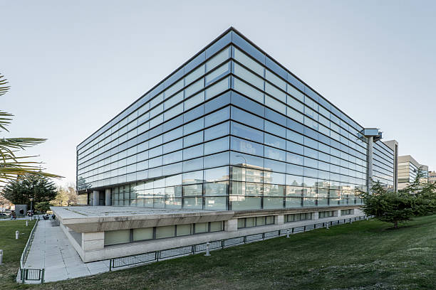 istock Office building with glass facade surrounded by gardens 2240231385