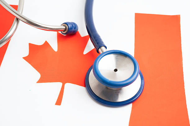 istock Canada flag with stethoscope, Business and finance. 2240231502