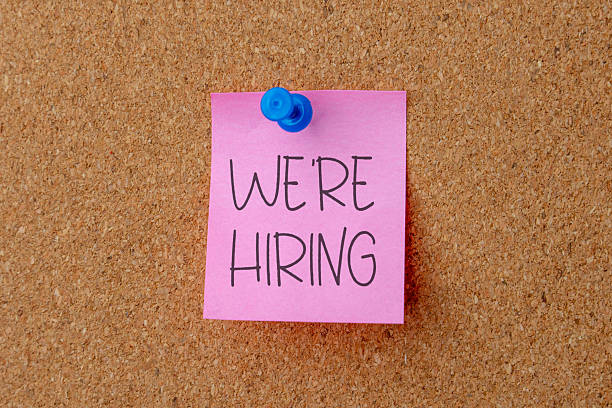 istock A note pinned to a corkboard displays the message WE'RE HIRING. 2240232435