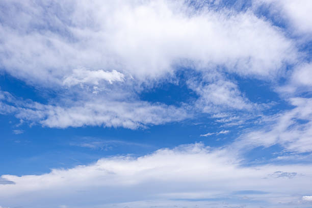 istock Panoramic view of clear blue sky and clouds, Blue sky background with tiny clouds. White fluffy clouds in the blue sky. Captivating stock photo featuring the mesmerizing beauty of the sky and clouds. 2240232451