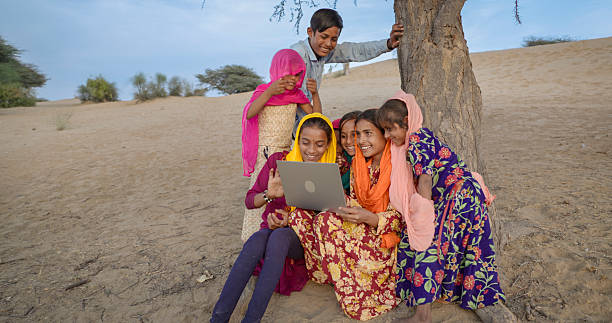 istock Happy Indian children using laptop, India 2240233756