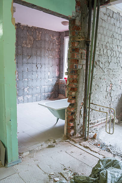 istock construction site with unfinished wall and wheelbarrow in a residential renovation project. closeup. 2240235847