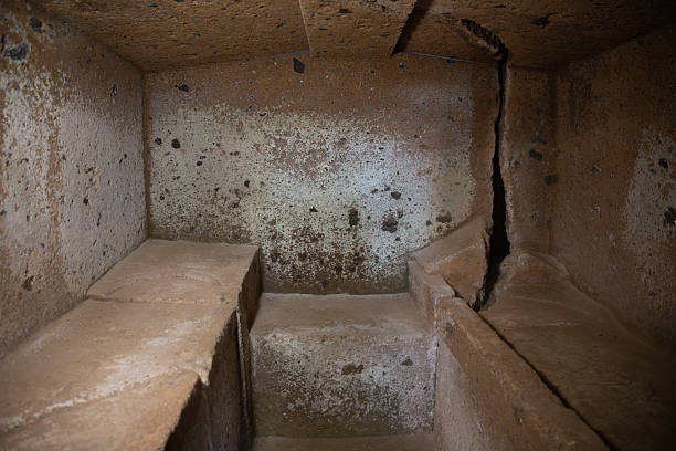 View of the Inside of Etruscan necropolis of Cerveteri (Banditaccia), an ancient burial site dating back to the 9th–3rd century BC. The archaeological area features grass-covered tomb mounds and rock-cut chambers, representing one of the most important remains of the Etruscan civilization in central Italy.