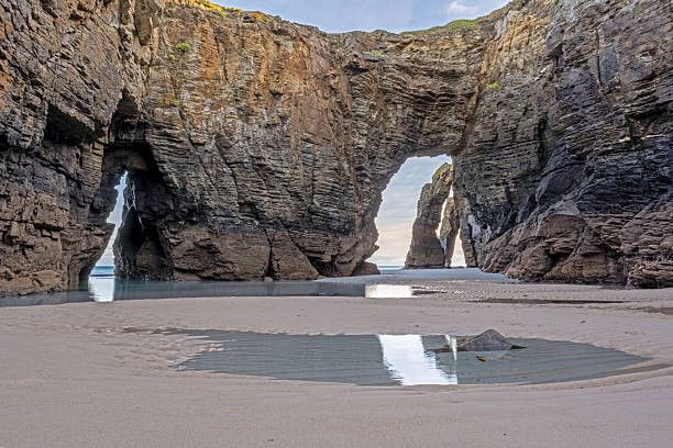 istock Rock arches on Las Catedrales Beach, Galicia 2240237286