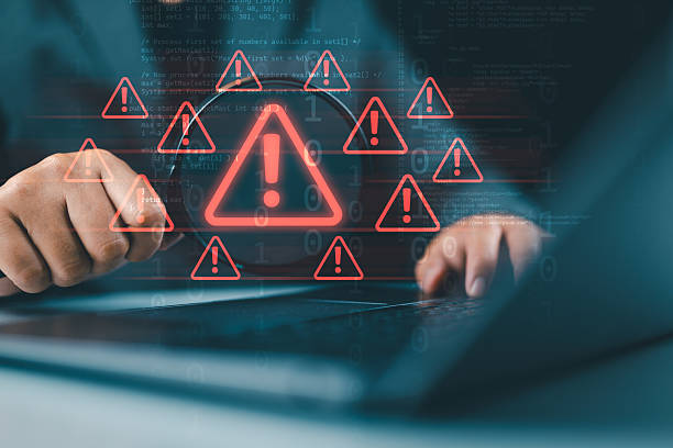 istock Cyberattack and security alerts concept, network failure dangerous, Caution of spam in website digital technology. Man using magnifying glass focus to error 404 alerts on virtual screen. 2240237541