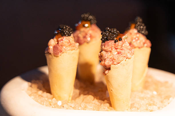 Delightful Gourmet Appetizer Featuring Luxurious Tar Tar Served in Elegant Mini Cones