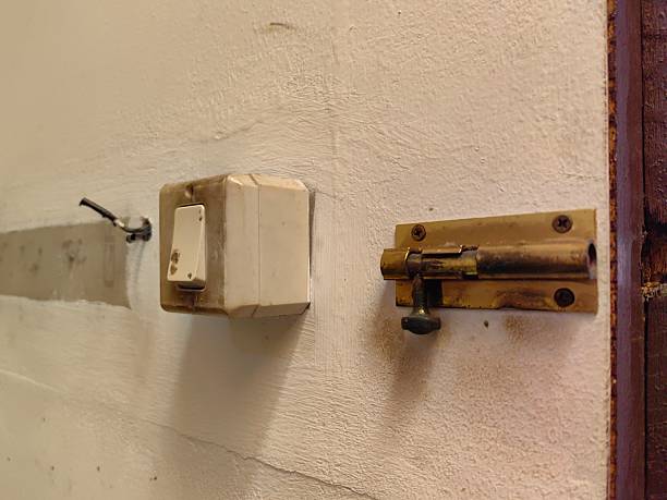 istock The light switch is next to the door hinge. 2240237764