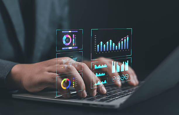istock Businessman typing on laptop with futuristic virtual data dashboard showing charts, graphs, and analytics, representing digital business intelligence, data management, and smart technology innovation. 2240237818