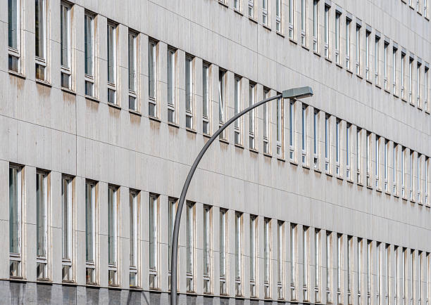 Germany, Berlin, Wilmersdorf, September 13, 2025 - Office building with windows in a row and a street lamp