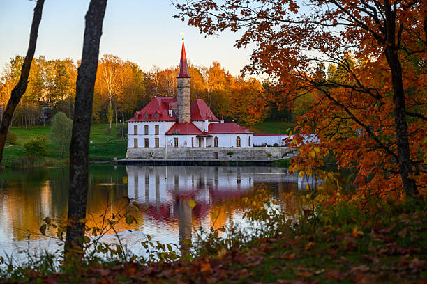 Russia, Gatchina, October 8, 2025: Gothic Priorat Palace in Gatchina autumn view from Black Lake.