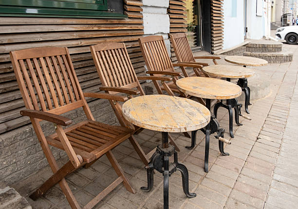 Tables and chairs in a street cafe
