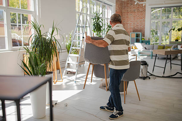 istock Smiling senior man moving into new apartment 2240242735