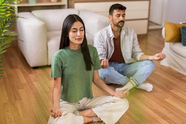 istock Couple practicing meditation together for calm and wellness 2240245947