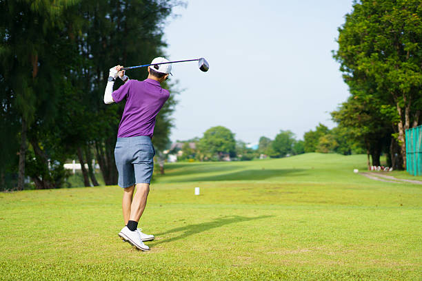 istock Asian golfer playing golf in morning. He playing a tee off shot. 2240249230
