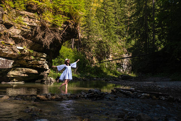 Woman Dancing in a Forest Stream Mountain river