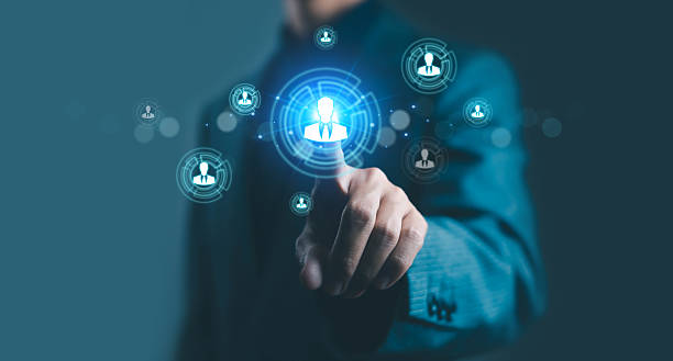 istock Businessman selecting virtual human icon for recruitment and HR management concept. Digital technology and data network connection for employee analytics and online human resource solutions. 2240252929