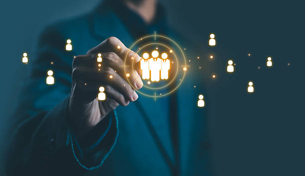 istock Businessman touching virtual group icon representing team management, HR recruitment, and digital human resource technology for business analytics and workforce connection. 2240252931