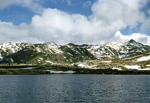 Panoramic view of Lac Blanc surrounded by mountain pastures in Vanoise (France)