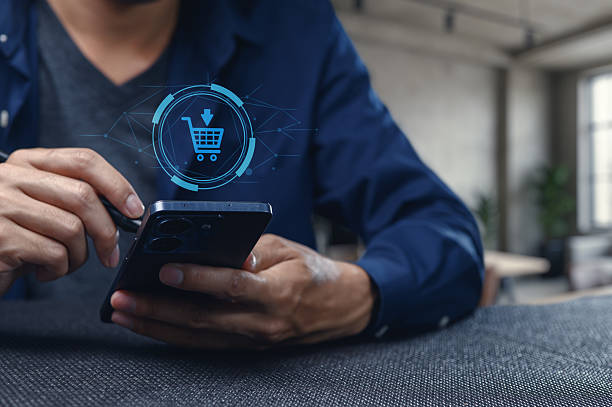 istock Person Using Smartphone for Online Shopping in Modern Workspace 2240253790