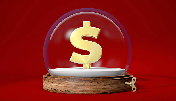 istock Golden Dollar Sign Key in Snow Globe 2240255247