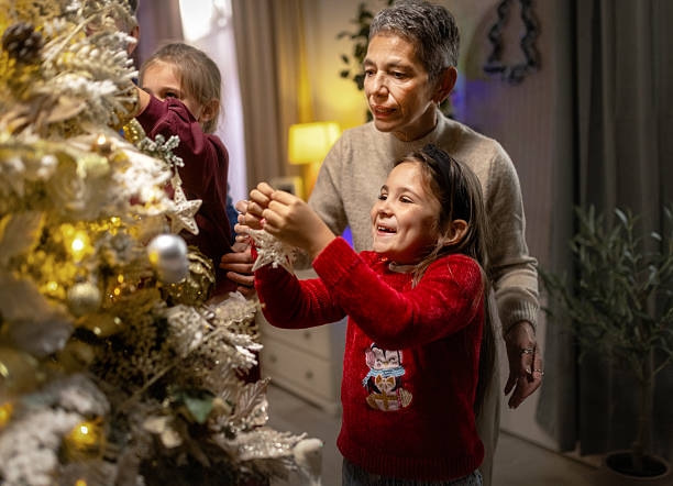 istock Three generations celebrating Christmas holidays together 2240255272