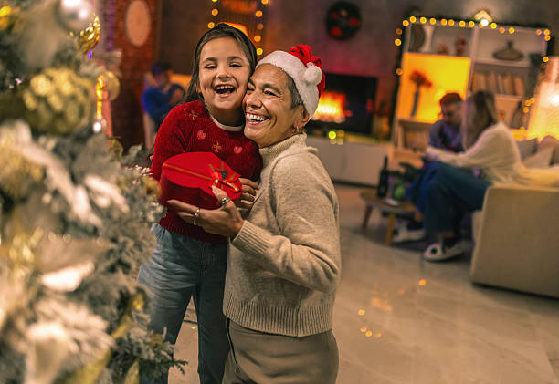 istock Three generations celebrating Christmas holidays together 2240255593