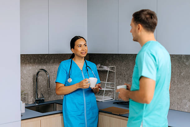 istock Two medical colleagues having coffee break at hospital kitchen 2240256084