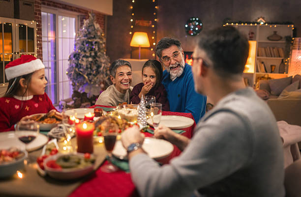 istock Multi generational family celebrating Christmas with festive dinner 2240258648