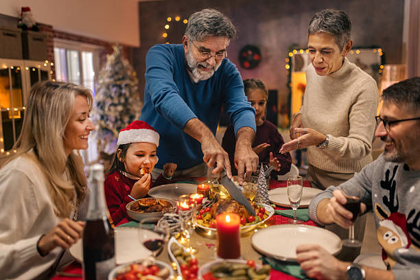 istock Multi generational family celebrating Christmas with festive dinner 2240258677