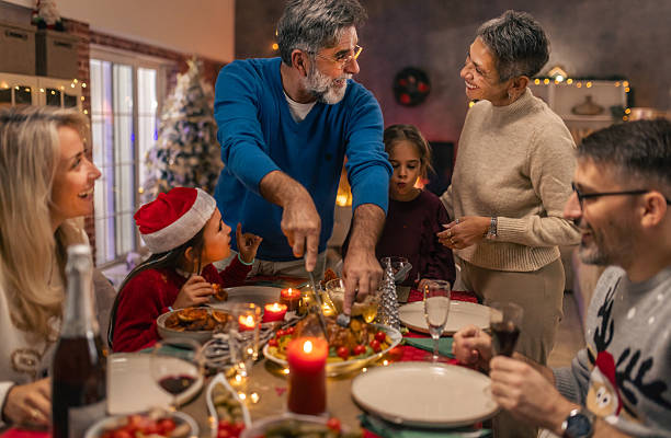 istock Multi generational family celebrating Christmas with festive dinner 2240258718