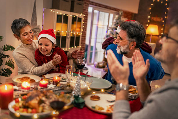 istock Multi generational family celebrating Christmas with festive dinner 2240259045