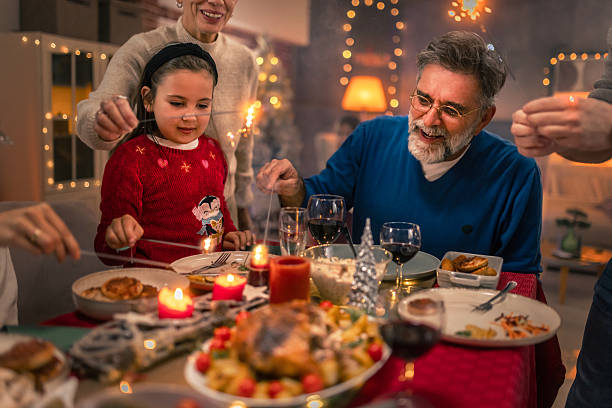 istock Multi generational family celebrating Christmas with festive dinner 2240259110