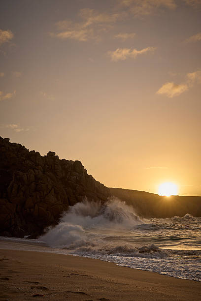 istock Coastline with breaking waves at Porthcurno beach during a beautiful sunrise, Cornwall, England, UK 2240261036