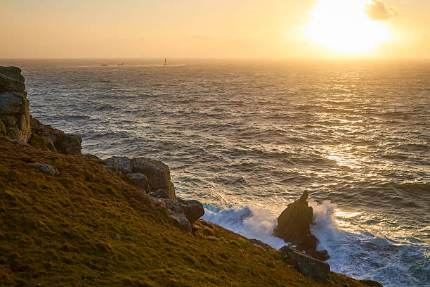 Coastline at Sennen during a stormy sunset, Cornwall, England, UK