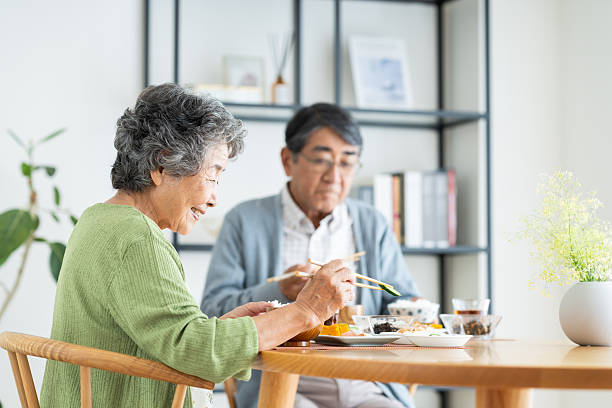 istock Senior couple having breakfast at home 2240262727
