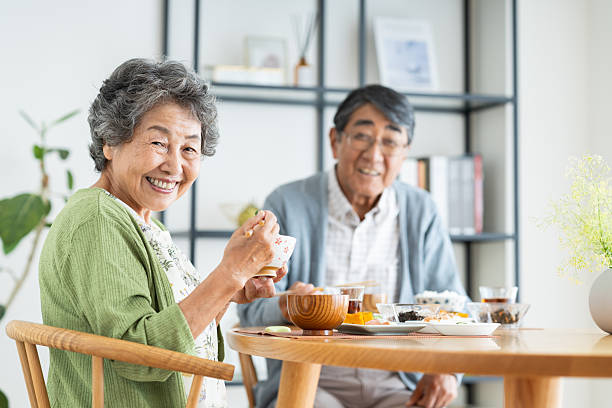 istock Senior couple having breakfast at home 2240262744