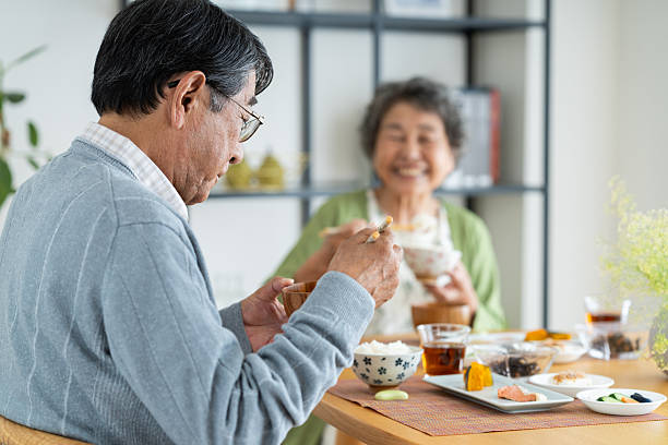 istock Senior couple having breakfast at home 2240263214