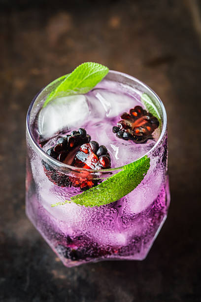 istock Gin based cocktail with blackberry and sage leaves 2240264690