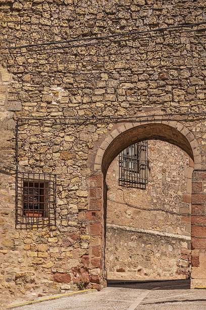 istock Access arch in an old yellow stone wall 2240266459