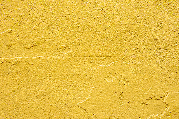 istock Concrete wall painted over and over again, the last one yellow. Vector paint texture background 2240266775
