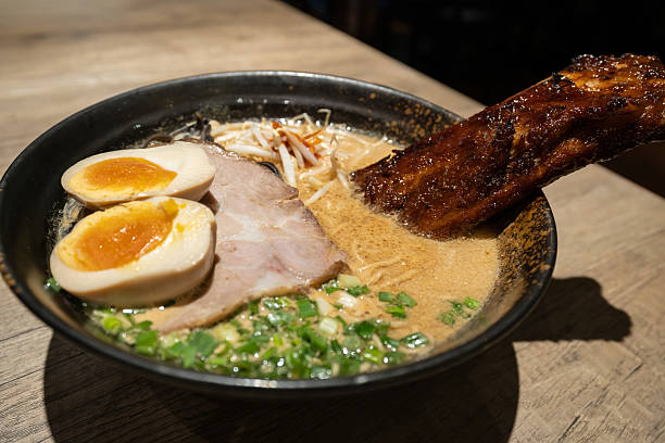 istock Pork broth based ramen topped with grilled marinated pork rib, slow cooked charsiu and soft boiled egg. 2240270067