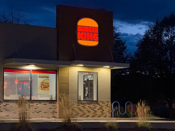 Boulder, Colorado, USA - October 9, 2025: Burger King fast food restaurant with its iconic illuminated sign at dusk
