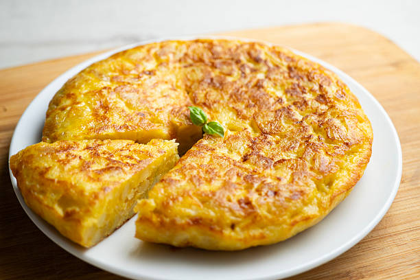 istock Traditional Spanish potato omelet. Step-by-step recipe to learn how to cook. 2240272340