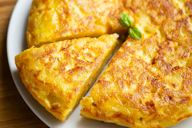 istock Traditional Spanish potato omelet. Step-by-step recipe to learn how to cook. 2240272345