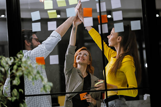 istock Team collaboration and brainstorming session with colorful sticky notes in a modern office environment during the afternoon 2240272643