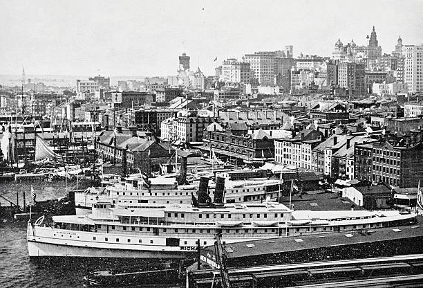 istock New York City, View from the Brooklyn Bridge looking southwest toward Manhattan’s waterfront and early skyline in New York City. Steamships, warehouses, and early skyscrapers of 1899 are visible 2240272835
