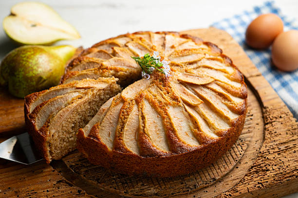istock Whole-wheat cake with baked pear and cinnamon. Step-by-step recipe to learn how to cook. 2240273732