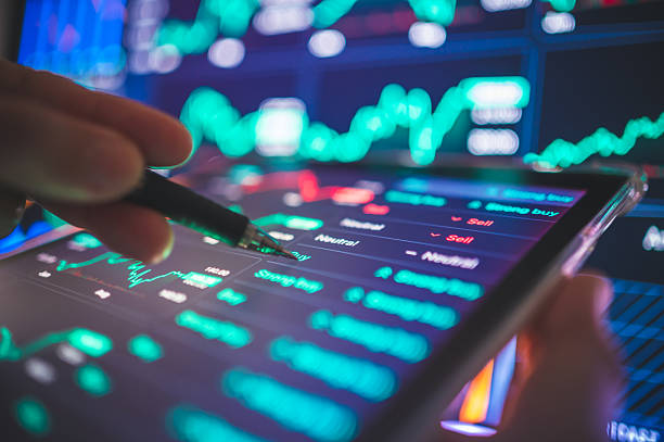 istock Futuristic trading interface showing advanced stock market indicators and digital data flow in vivid color. Ideal for fintech, AI-driven analytics, and investment technology visuals. 2240278141